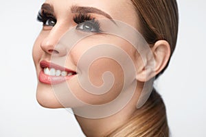 Beautiful Smiling Girl With Beauty Makeup And Long Eyelashes