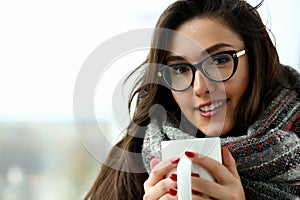 Beautiful smiling girl hold in arms cup portrait