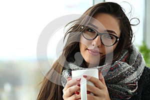 Beautiful smiling girl hold in arms cup portrait