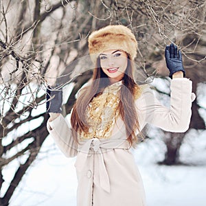 Beautiful smiling girl portrait in winter