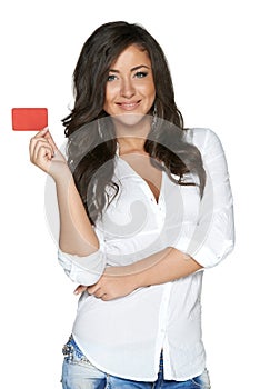 Beautiful smiling girl showing red card in hand