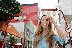 Beautiful smiling girl walking in Sao Paulo japanese neighborhood Liberdade, Sao Paulo, Brazil photo