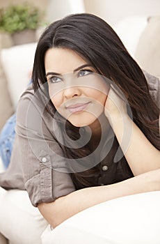Beautiful Smiling Hispanic Woman on Sofa Relaxing