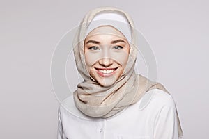 beautiful smiling islamic young woman with Make-up. beauty Happy girl in hijab