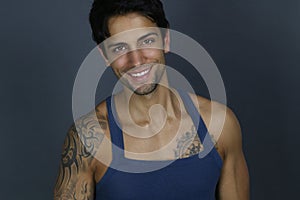 Beautiful smiling man wearing a tank top