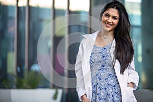 Beautiful smiling portrait of Indian American woman, medical practitioner, dental hygienist, scientist, health care specialist in