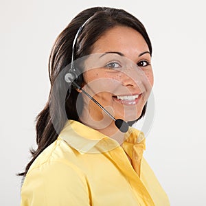 Beautiful smiling receptionist on the telephone