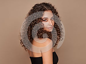 Beautiful smiling woman with afro curls