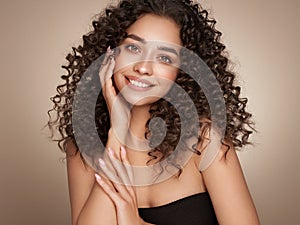 Beautiful smiling woman with afro curls