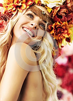 Beautiful smiling woman with colorful wreath
