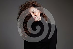 beautiful smiling woman with curly hair