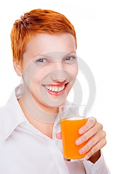 Beautiful smiling woman drinks orange juice