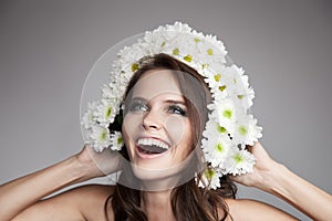 Beautiful Smiling Woman With Fower Wreath On Her Head. photo