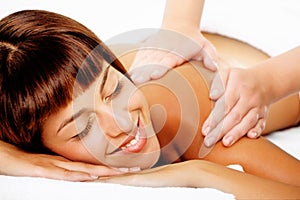 Beautiful smiling woman getting a massage.