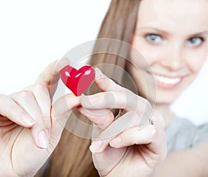 Beautiful smiling woman with heart