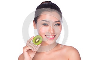 Beautiful smiling woman holding kiwi. Beauty shot