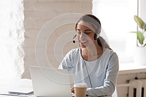 Beautiful smiling woman man working in headphones at office