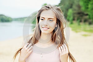 Beautiful smiling woman outdoor portrait