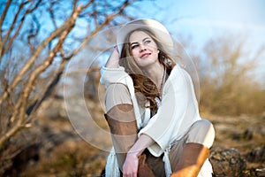 Beautiful smiling woman relaxing outdoors photo