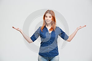 Beautiful smiling woman standing annd holding copyspace on both palms