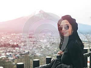 Beautiful smiling woman tourists are traveling and feel happy with Mt Fuji, Japan