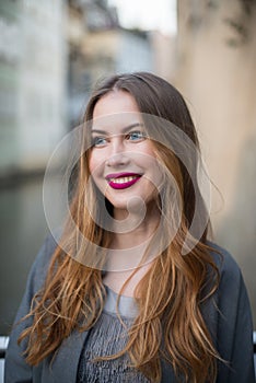 Beautiful smiling woman traveling in Venice, Italy