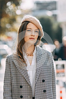 A beautiful smiling woman walking along a crowded city street. Street portraits in Istanbul.