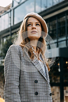 A beautiful smiling woman walking along a crowded city street. Street portraits in Istanbul.