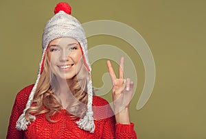 Smiling woman wearing winter clothing.