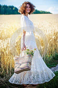 Beautiful smiling woman in white syled dress outdoors