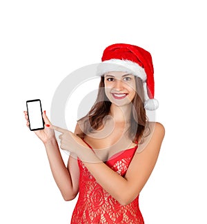 Beautiful smiling young girl in christmas hat and swimsuit presenting mobile phone. emotional woman in red santa claus hat isolate