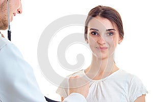 Beautiful smiling young girl at the doctor close-up