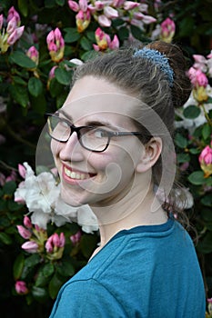 Beautiful smiling young woman with blonde hair bun