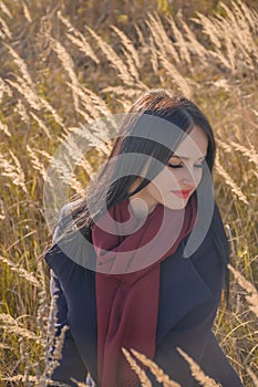 Beautiful smiling young woman with long eyelashes and closed eyes