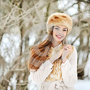 Beautiful smiling young woman portrat in winter photo