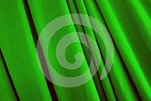 Beautiful smooth elegant green silk or satin texture can use as background. fabric design