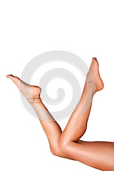 Beautiful smooth woman`s legs after laser hair removal on the white background.