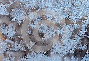 Beautiful snow patterns, water ornaments on transparent glass.Christmas snowflakes.