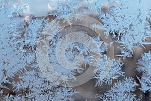 Beautiful snow patterns, water ornaments on transparent glass.Christmas snowflakes.