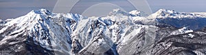 Beautiful snowy Caucasus mountain peaks. Scenic winter panoramic landscape in Krasnaya Polyana, Sochi, Russia