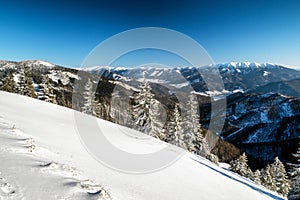 Beautiful snowy country in winter mountains. View from Great Fatra mountains on Low Tatras at Slovakia