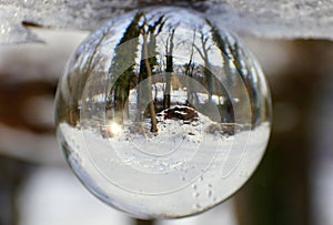 Beautiful snowy landscape captured through a lens ball