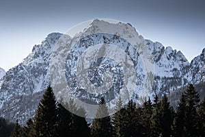 Beautiful snowy mountain peak in julian alps