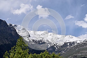 Beautiful Snowy Mountains in a sunny day