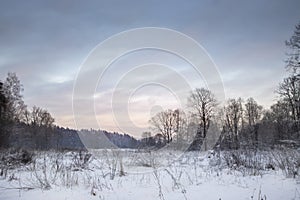 Beautiful snowy winter landscape panorama with sun