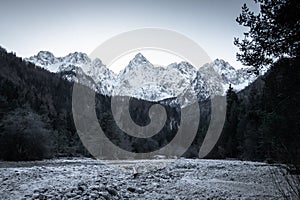 Beautiful snowy winter mountain range landscape in julian alps, slovenia