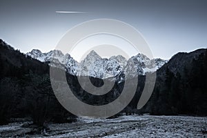 Beautiful snowy winter mountain range landscape in julian alps, slovenia