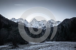 Beautiful snowy winter mountain range landscape in julian alps, slovenia