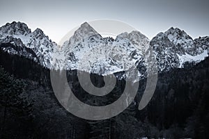 Beautiful snowy winter mountain range landscape in julian alps, slovenia