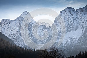 Beautiful snowy winter mountain range landscape in julian alps, slovenia